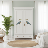 White wardrobe with bird design in a bedroom setting