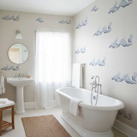 Bathroom with white freestanding bathtub, sink, and decorative wall patterns.