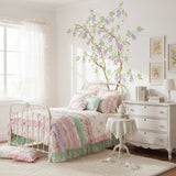 Wisteria Tree Wall Stencil painted on the wall of a little girl's room.