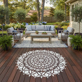 Mandala design on a stained deck with patio furniture.