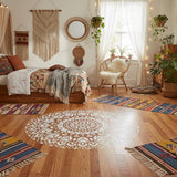 Mandala design painted onto a wooden floor in a Bohemian style bedroom.