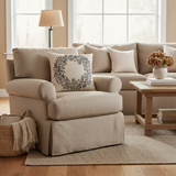 Beige sofa with decorative pillows in a living room setting