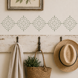 Amiens French Heritage Stencil applied to a wall over a coat hook.