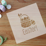 easter stencil with craft supplies around it.
