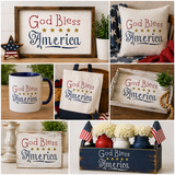 Collage of 'God Bless America' themed decor items including signs, pillows, mugs, and tote bags.