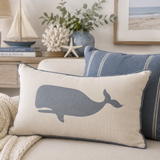 Reusable Nautical Whale stencil applied to a linen pillow in a beach house living room.