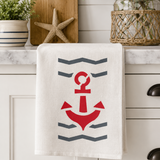 Kitchen towel with red anchor design on a kitchen counter