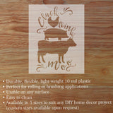 Decorative stencil with animal silhouettes and text on a wooden surface