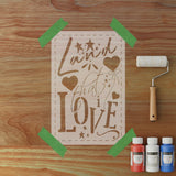 Decorative paper cutout with 'I loved that I love' text on a wooden surface