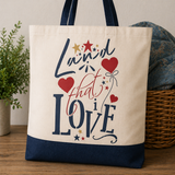 Tote bag with decorative text and hearts on a wooden surface