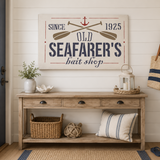 Nautical-themed decor in a room with a wooden console table, sign, and decorative items.