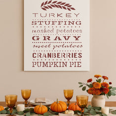 Thanksgiving dinner table setting with a DIY painted sign using the Thanksgiving Dinner Craft Stencil from Designer Stencils.