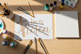 White cross and 'He is Risen' text on a light gray background