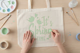 Tote bag being painted with pastel acrylic paints