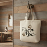 Decorative text 'Mama Bear' with paw prints on a white background