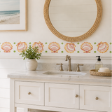 Scallop Shells stencil painted onto the backsplash of a bright and sunny bathroom
