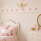 Small Dotted Scallop Wall Stencil Border painted onto a wall in a princess theme bedroom