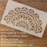 Laser cut stencil with decorative pattern on a wooden surface, featuring text about product features.