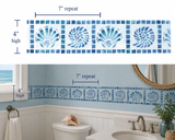 Bathroom wall with blue shell patterned tile border