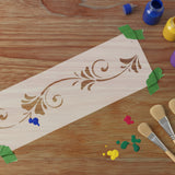 Stencil being painted with brushes and craft paint