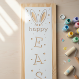 Easter Porch Stencil Being painted onto a wooden porch sign.