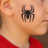 Boys face painted with Spiderman Spider using the Comic Book Spider Face Painting Stencil Set