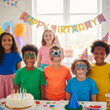 Children with face paint at a birthday party, wearing party hats and smiling.