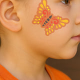 butterfly painted onto a girls face using the Butterfly Face Painting Stencil Set