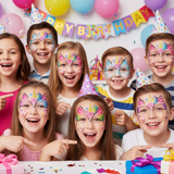 Children with face paint at a birthday party, wearing party hats and balloons in the background.