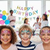 Children with face paint at a birthday party, smiling and posing for the camera.