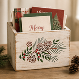 Wooden box with Christmas card designs on a wooden surface