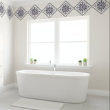 Three diamond-shaped decorative tiles with floral patterns in a blue color.