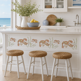 Kitchen with white cabinets, marble countertop, and decorative lobster pattern on the wall.