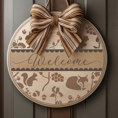 Woodland Welcome Round Sign Stencil Painted onto a wooden sign and hung on a front door.

