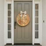 Decorative Christmas wreath on a gray front door with white trim.