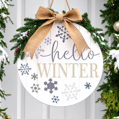 Decorative stencil round sign with 'Hello Winter' and snowflakes, perfect for holiday home décor and crafts.