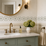 Bathroom vanity with sink, mirror, and decorative elements and the Verona Tile Design stenciled onto the wall
