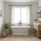 Modern bathroom with freestanding bathtub, wooden vanity, and decorative wall patterns.