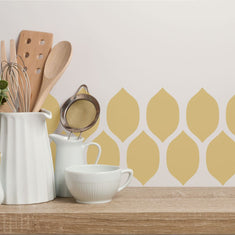 Lemonesque Border Wall Stencil applied along a kitchen wall
