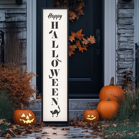 Decorative 'Happy Halloween' sign with pumpkins and leaves in front of a house door.