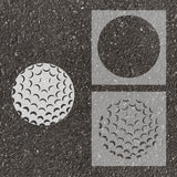 Golf ball stenciled on pavement with matching 2 part stencil.