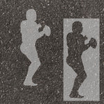 Football quarterback silhouette stenciled on pavement with matching stencil.