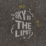'The Sky is the Limit' stencil text with measurements on pavement.