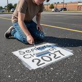 Seniors Class of 2027 Stencil being painted onto a Senior Parking Space