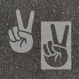 Peace stenciled on pavement with matching parking space stencil.