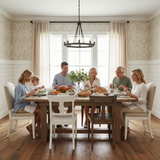 Family gathered around a dining table for a meal in a well-lit room.