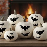 Halloween Bats Craft Stencil painted onto white pumpkins.