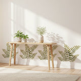 Fern Stencil that has been painted onto a white wall in a bright and sunny room.