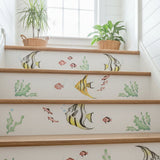Tropical Fish Stencil painted onto wooden stairs at a beach house.