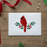 Cardinal and Berries Stencil that has been applied to a blank white greeting card for Christmas